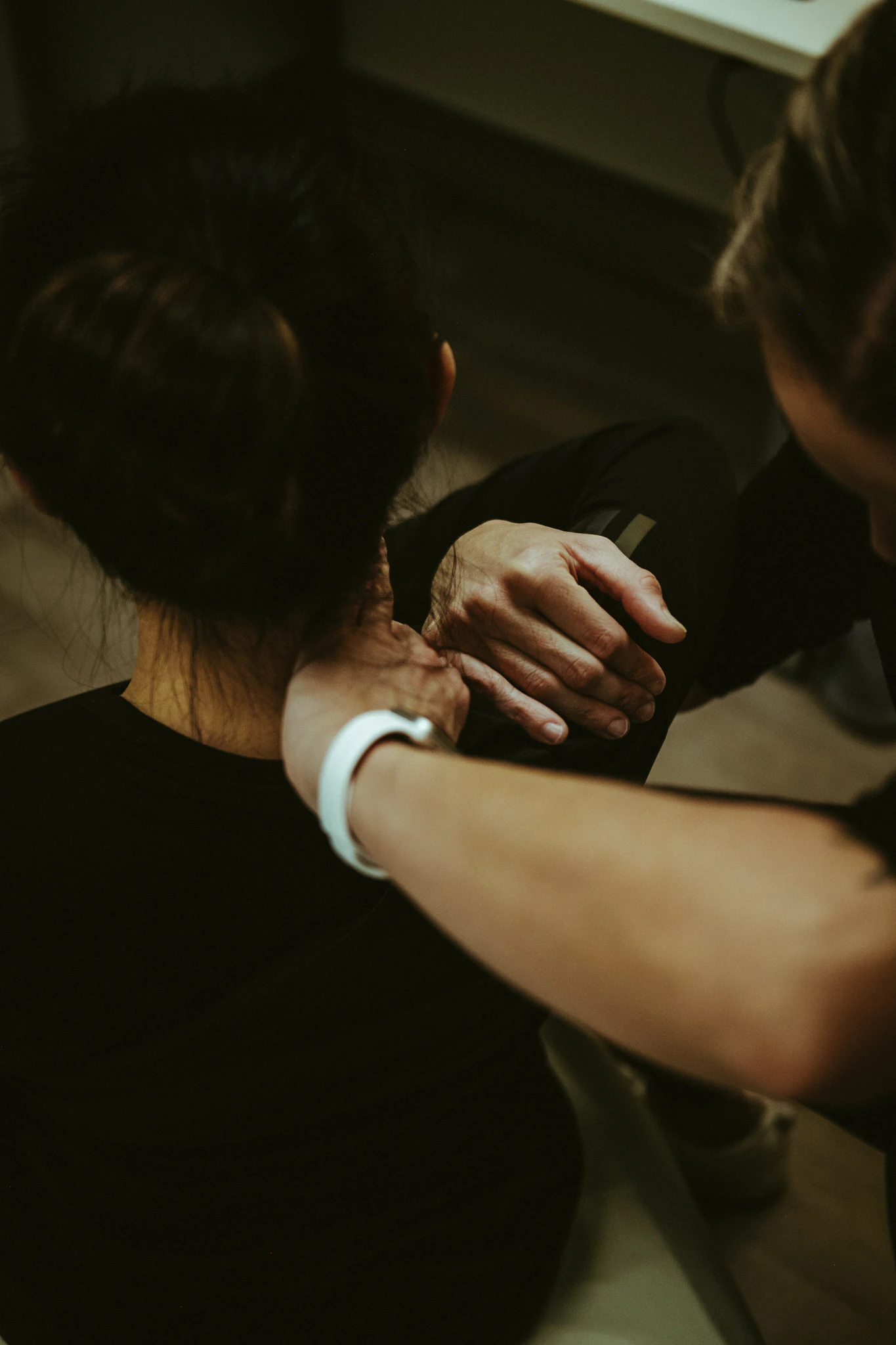 Aneta applying Active Release Techniques® to a client’s neck and shoulder